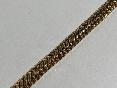 Bracelet en or jaune 18K à maille gourmette.

Poids...