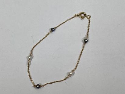 Bracelet in 18K yellow gold with small stylized...