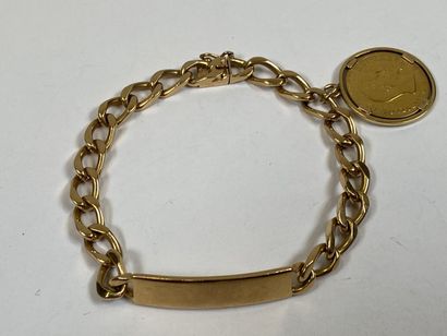 18K yellow gold bracelet or curb chain adorned...