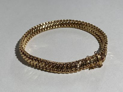 Bracelet en or jaune 18K à maille gourmette.

Poids...