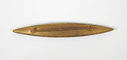 Brooch of navette form in gilded metal decorated...