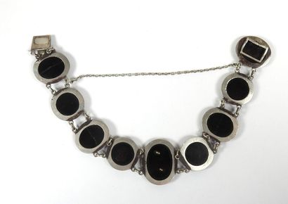 Silver bracelet with eight circular or oval...
