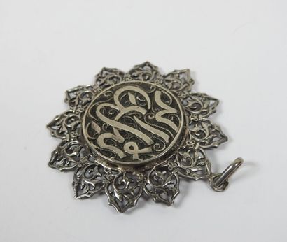 Silver pendant centered of an Arabic calligraphy...