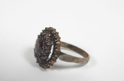 Silver ring decorated with numerous garnets...
