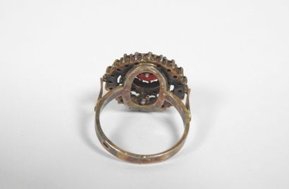 Silver ring decorated with numerous garnets...