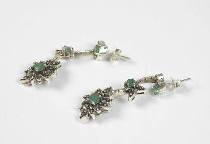 Pair of silver earrings decorated with stylized...