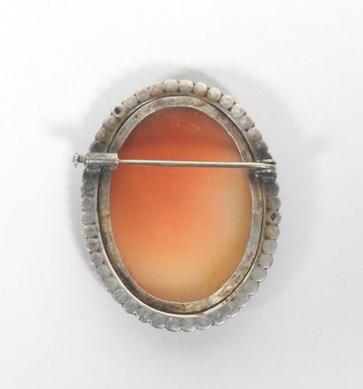 Oval silver brooch decorated with a cameo...