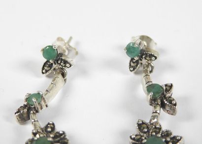 Pair of silver earrings decorated with stylized...