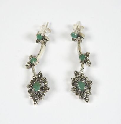 Pair of silver earrings decorated with stylized...