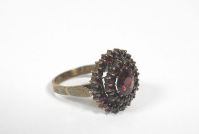 Silver ring decorated with numerous garnets...