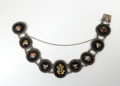 Silver bracelet with eight circular or oval...