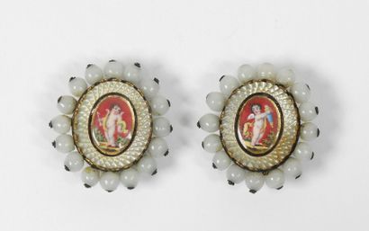 Two oval ornamental elements in silver or...