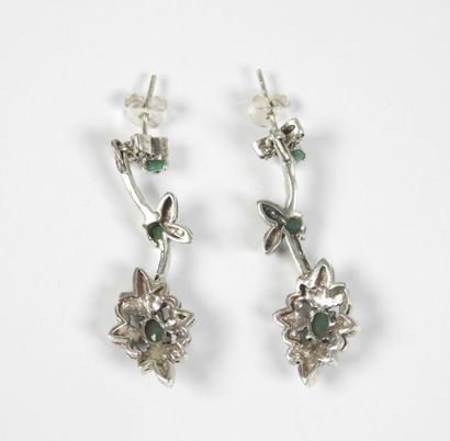 Pair of silver earrings decorated with stylized...