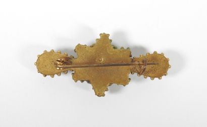 Brooch in gilded metal decorated with a star...