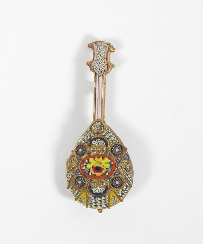 Gilded metal brooch decorated with a guitar...