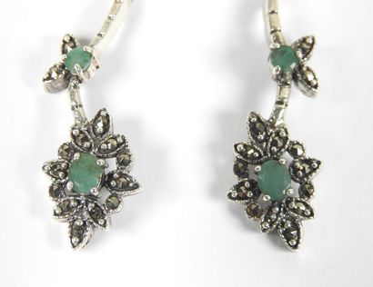 Pair of silver earrings decorated with stylized...