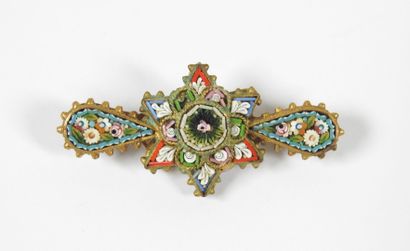 Brooch in gilded metal decorated with a star...
