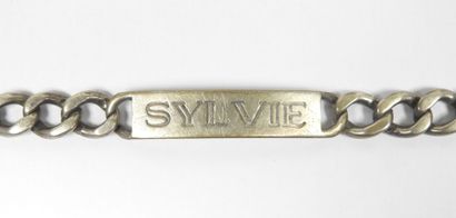 Gourmette patronymique de dame en argent...