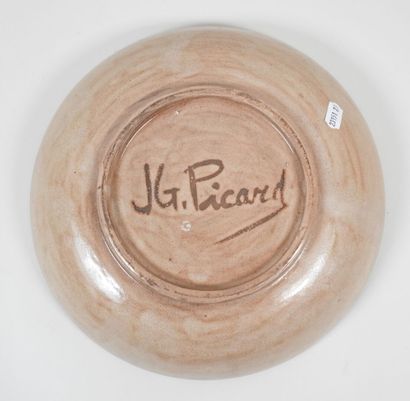 J.G. PICARD (XXe).
Plat circulaire en céramique...