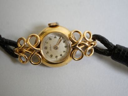 Ladies' gold watch on black bracelet.
C 14.79...