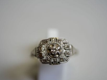 2 gold rings, one in white gold with diamonds...