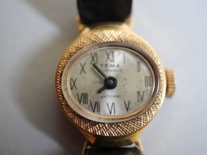 YEMA.
Gold ladies' watch on black bracelet.
C...