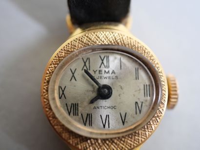YEMA.
Gold ladies' watch on black bracelet.
C...
