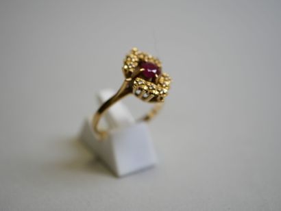 Red stone** gold ring with round center TDD...