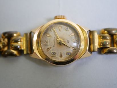 LIP.
Gold ladies' watch on metal bracelet
C...