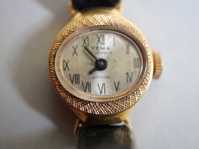 YEMA.
Gold ladies' watch on black bracelet.
C...