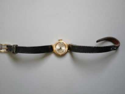 YEMA.
Gold ladies' watch on black bracelet.
C...