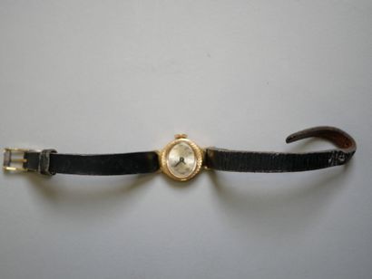 YEMA.
Gold ladies' watch on black bracelet.
C...
