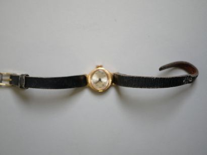 YEMA.
Gold ladies' watch on black bracelet.
C...