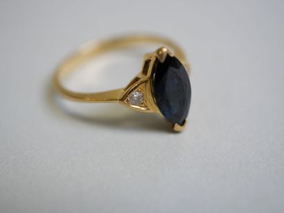 Blue oval stone** gold ring with 2 diamonds...