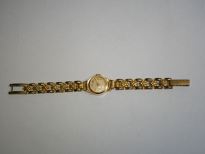 LIP.
Gold ladies' watch on metal bracelet
C...