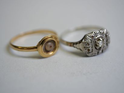 2 gold rings, one in white gold with diamonds...