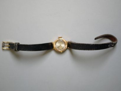 YEMA.
Gold ladies' watch on black bracelet.
C...