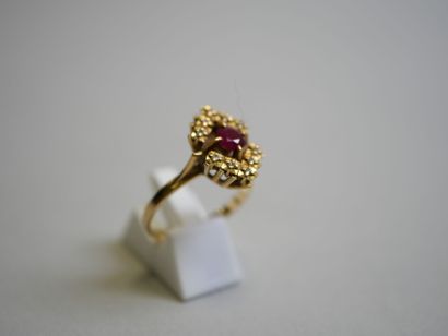 Red stone** gold ring with round center TDD...
