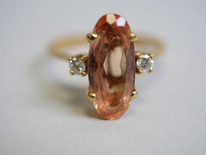 Orange stone** gold ring with 2 small diamonds...