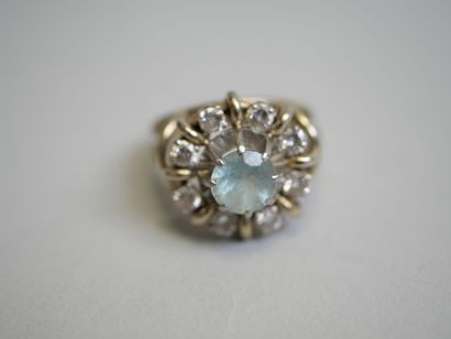 White gold ring set with a round blue stone**...