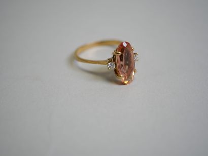 Orange stone** gold ring with 2 small diamonds...