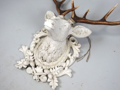 White lacquered resin stag head topped with...