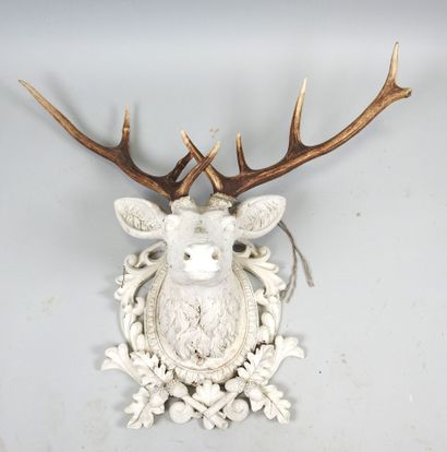 White lacquered resin stag head topped with...