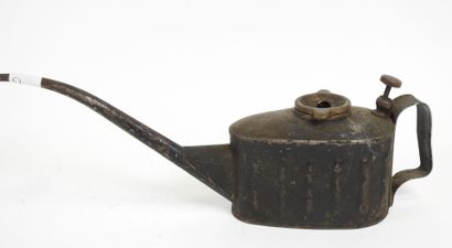 Antique tin oil cruet with long spout.
7...