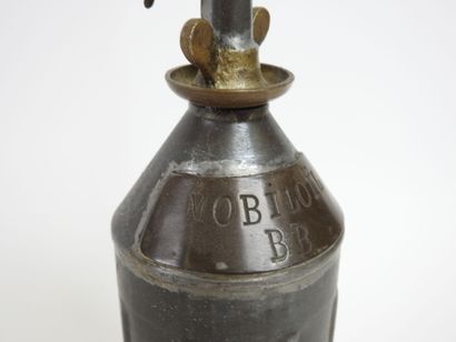 BP-Mobiloil tin-plate and brass cruet, circa...