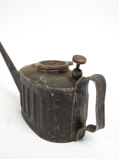 Antique tin oil cruet with long spout.
7...
