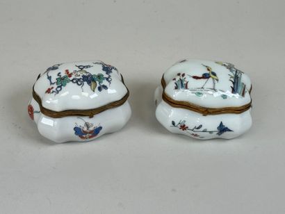 Two polychrome porcelain pillboxes decorated...