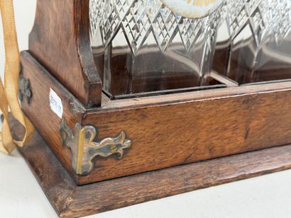 THE TANTALUS.
Wood and metal liquor cabinet...