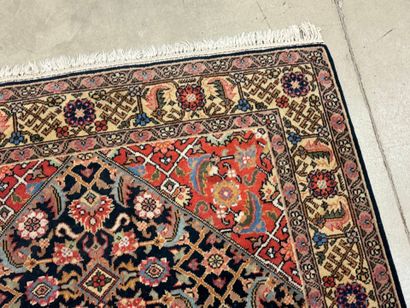 Oriental rug in knotted wool decorated with...