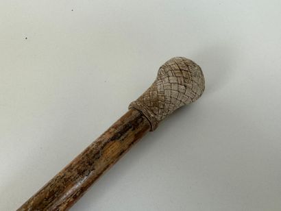 Wooden cane, braided rope knob, metal and...